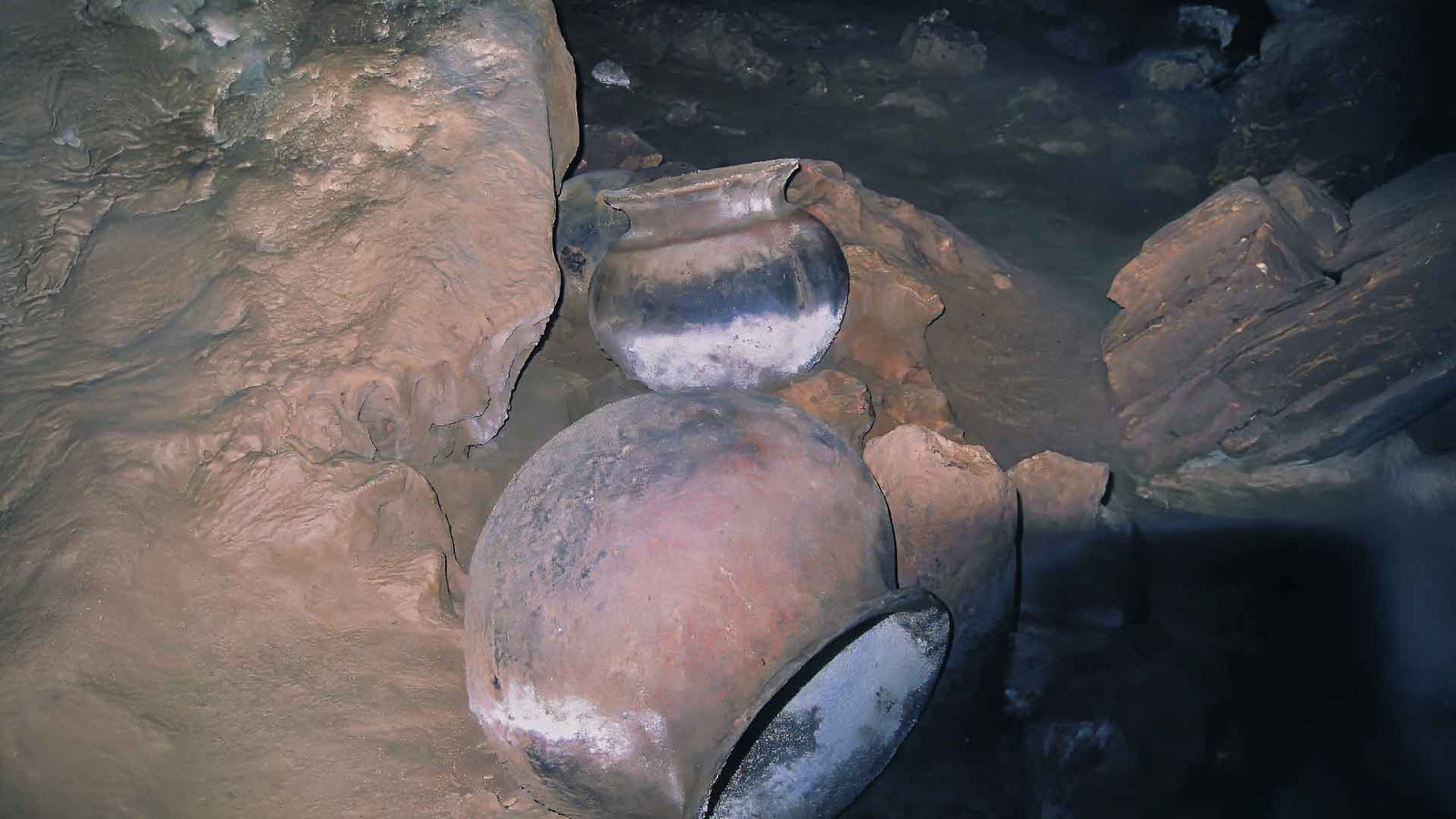 Ancient Maya ceramic pots inside the ATM Cave, discovered during the Actun Tunichil Muknal tour in Belize.