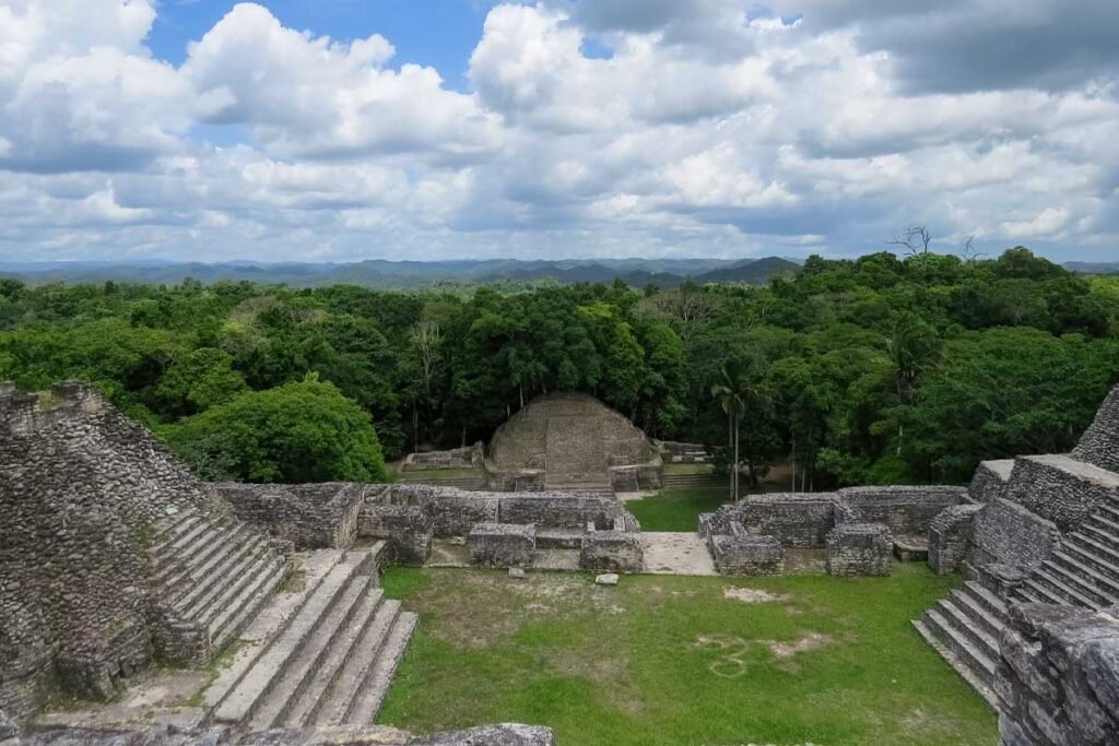 Ancient pyramids of the Caracol Maya site in Belize, a cultural highlight often paired with a Belize Tikal ruins exploration tour.