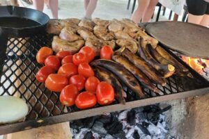 The grill is cooking the tomatoes in the Belize culinary experience