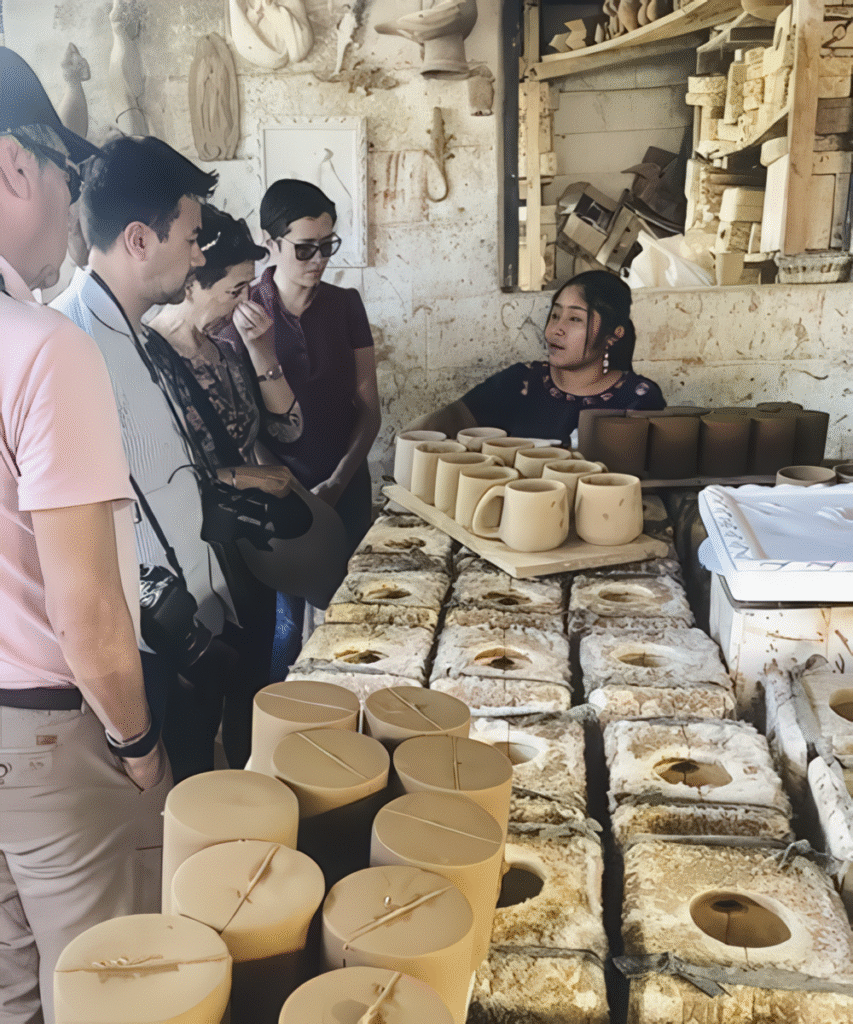 Family enjoying a hands-on Maya pottery workshop in Lake Atitlán, a cultural highlight featured in the Ultimate Belize and Guatemala Itinerary.