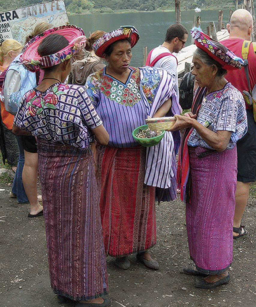 Maya T'zutujil woman in traditional colorful dress in Santiago Atitlán, a cultural highlight featured in the Ultimate Belize and Guatemala Itinerary.