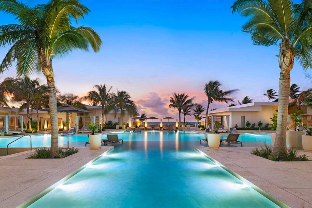 Alaia Belize - Authentic Travel Belize Luxury swimming pool and resort amenities at Alaia Belize, one of the best all-inclusive resorts in Ambergris Caye, featuring ocean views and tropical elegance.