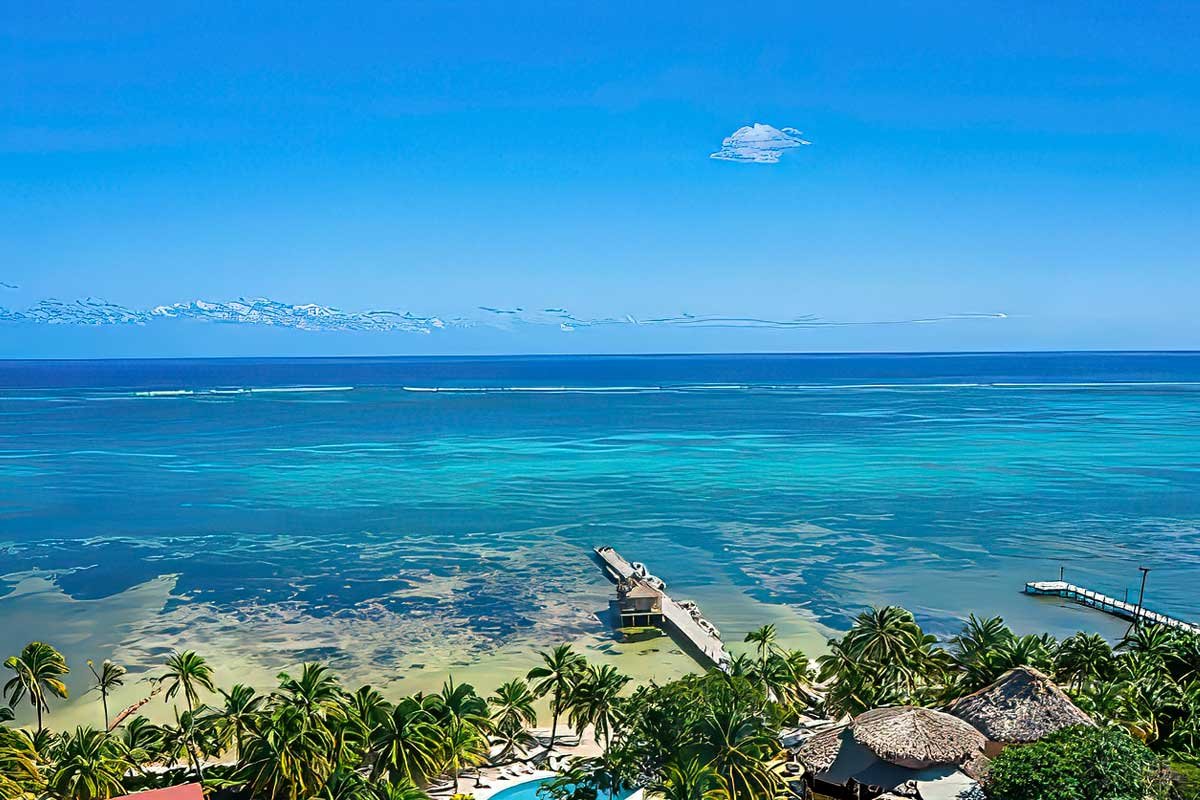 Scenic view of turquoise Caribbean waters and the Belize Barrier Reef near San Pedro, showcasing why Belize is safe for tourists seeking island adventures.