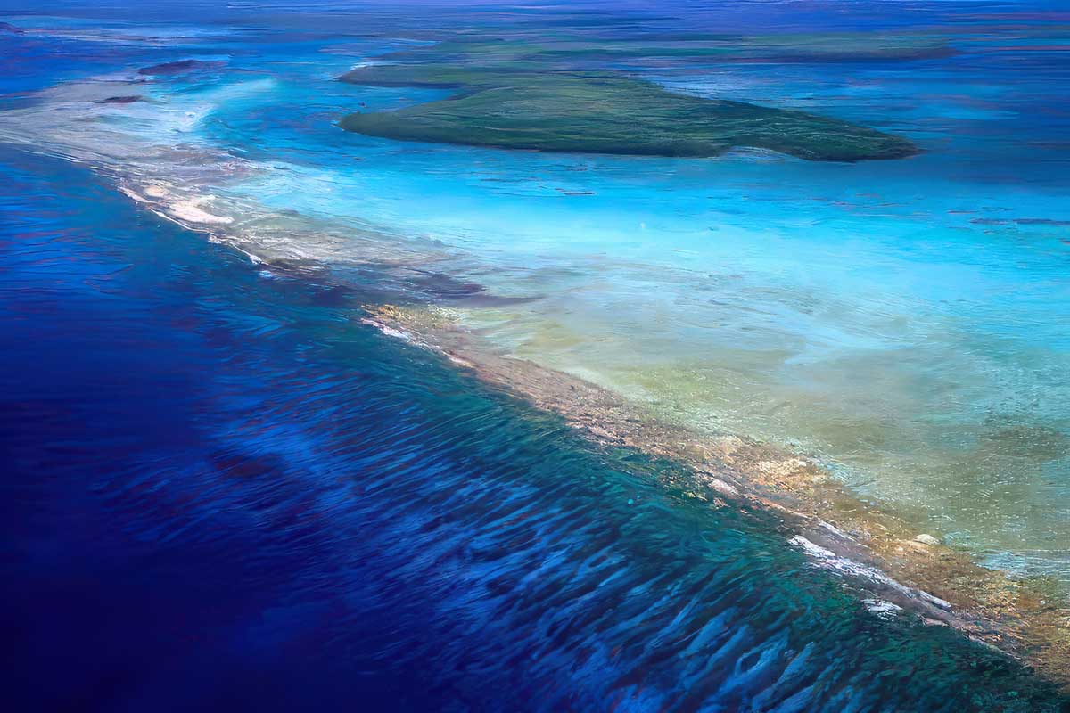 Aerial view of the Belize Barrier Reef, a stunning highlight included in many package holidays to Belize
