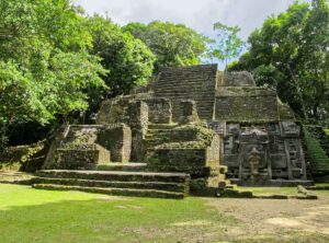 Lamanai ruins surrounded by tropical forest near the New River in Orange Walk Belize, showcasing ancient Maya architecture and northern Belize heritage.