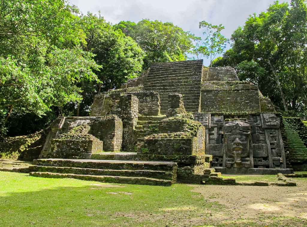 Lamanai ruins surrounded by tropical forest near the New River in Orange Walk Belize, showcasing ancient Maya architecture and northern Belize heritage.