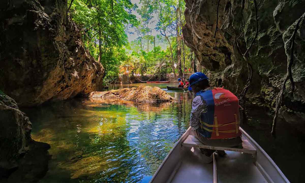 Barton-Creek-Caves Canoe entering Barton Creek Cave, one of the best things to do in San Ignacio for travelers interested in Maya archaeology and jungle adventure