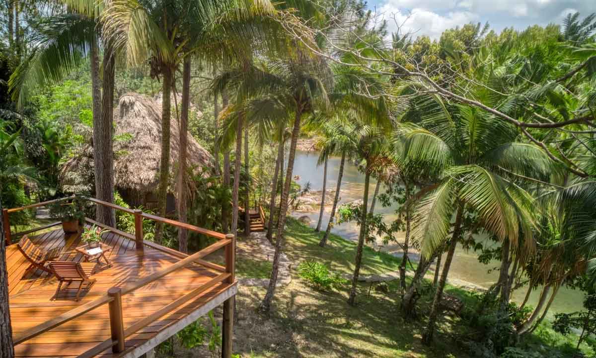 River-Side-Lodge Riverside jungle lodge near San Ignacio, Belize, with private deck overlooking the forest and river